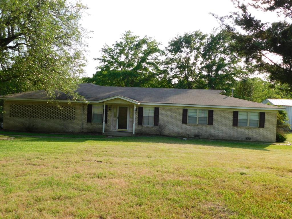 a front view of a house with yard