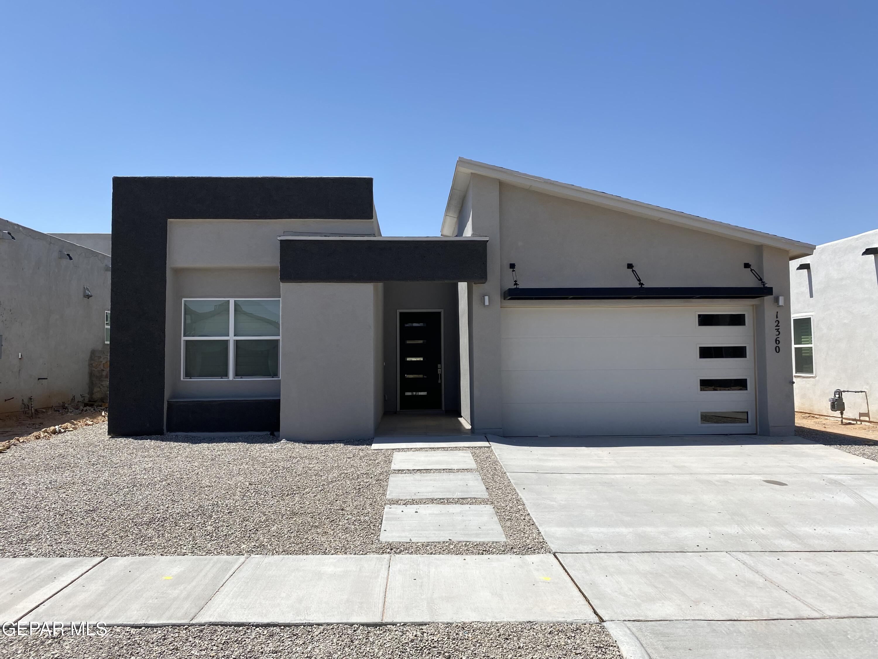 a front view of a house with a garage