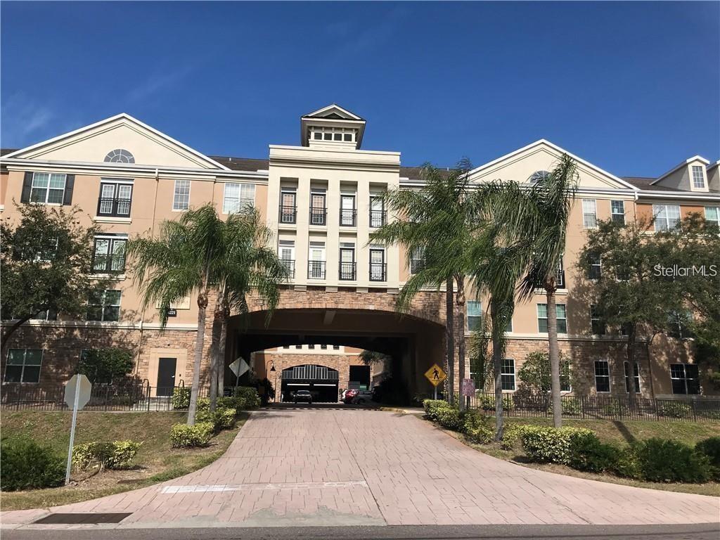 a front view of a building with a yard