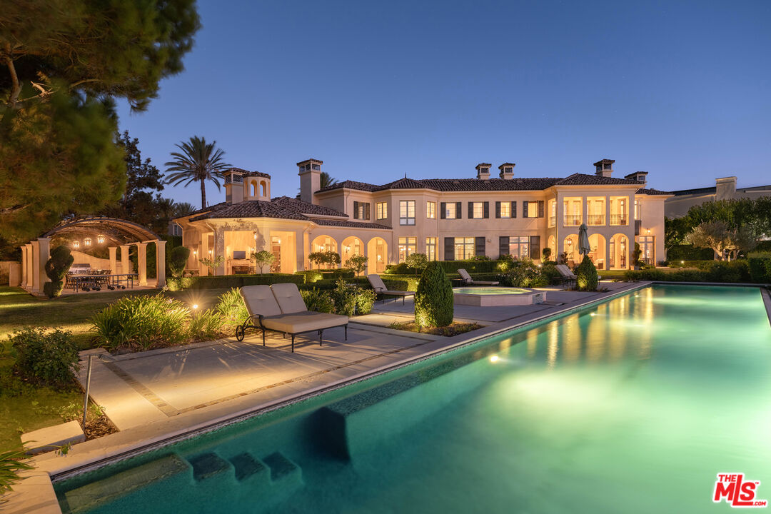 a view of a house with swimming pool