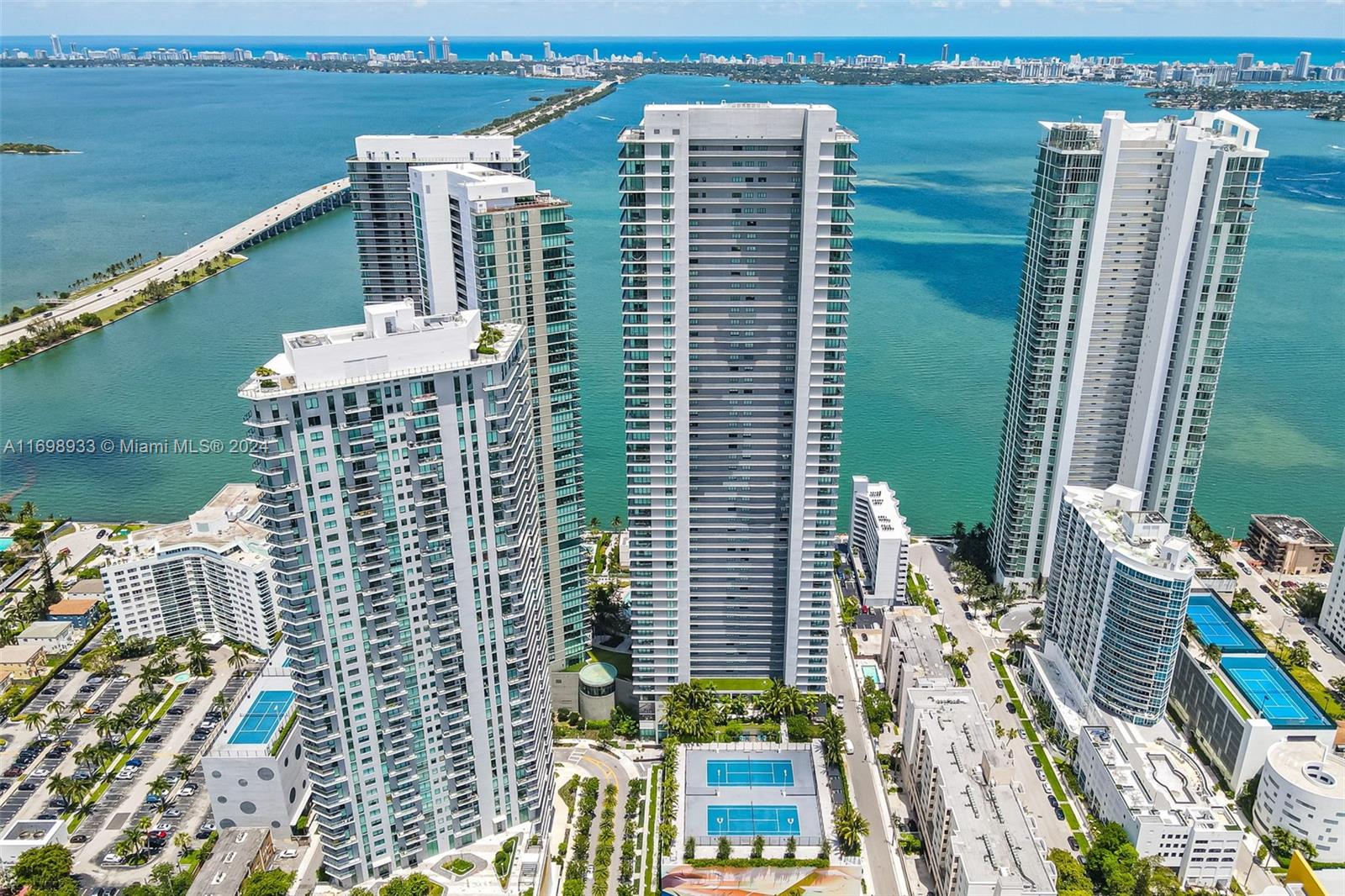 a view of building with outdoor space and ocean view