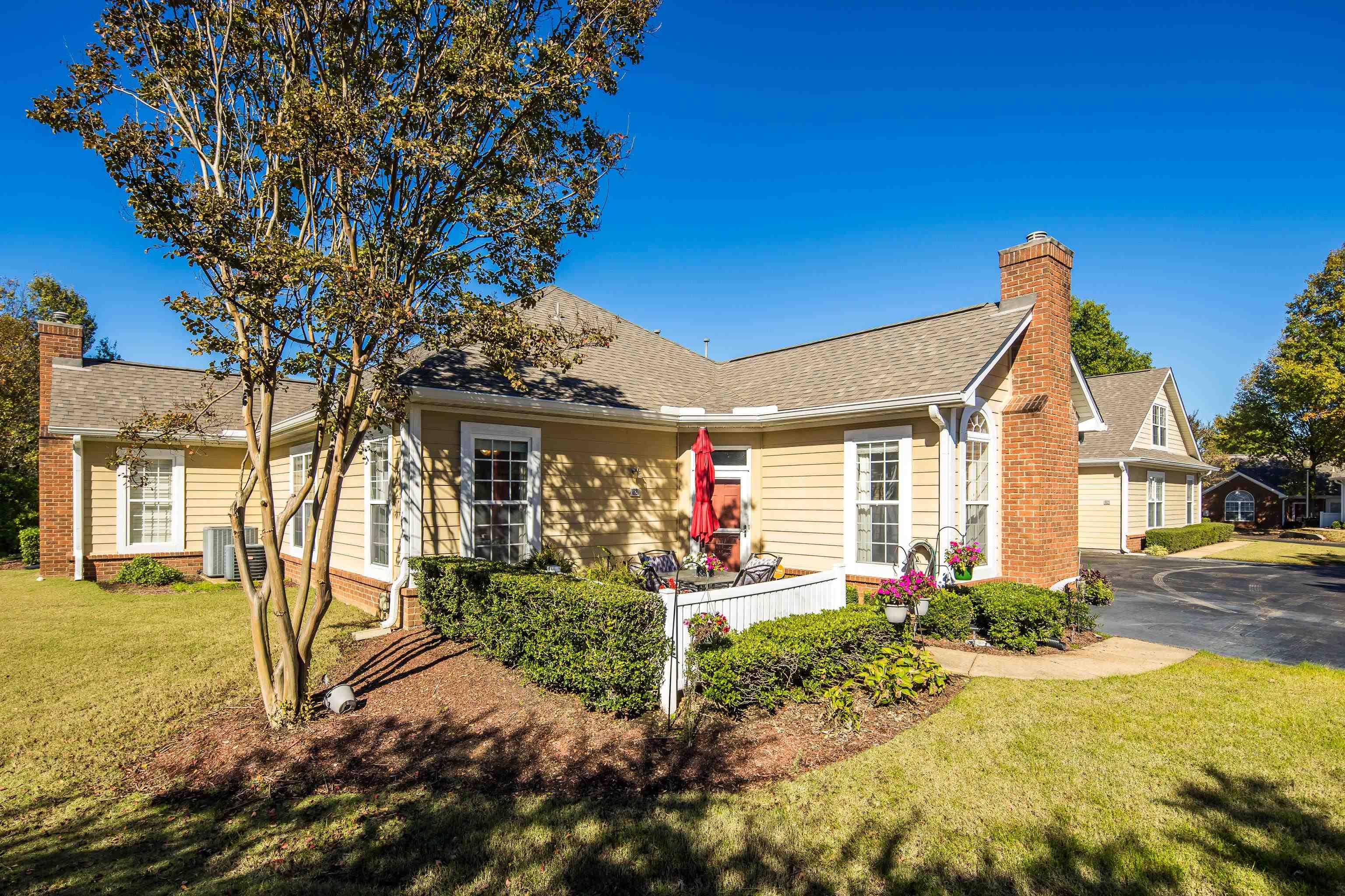 a front view of a house with garden