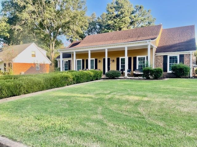 a front view of a house with a yard