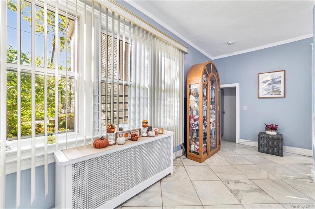 a living room filled with furniture and a window