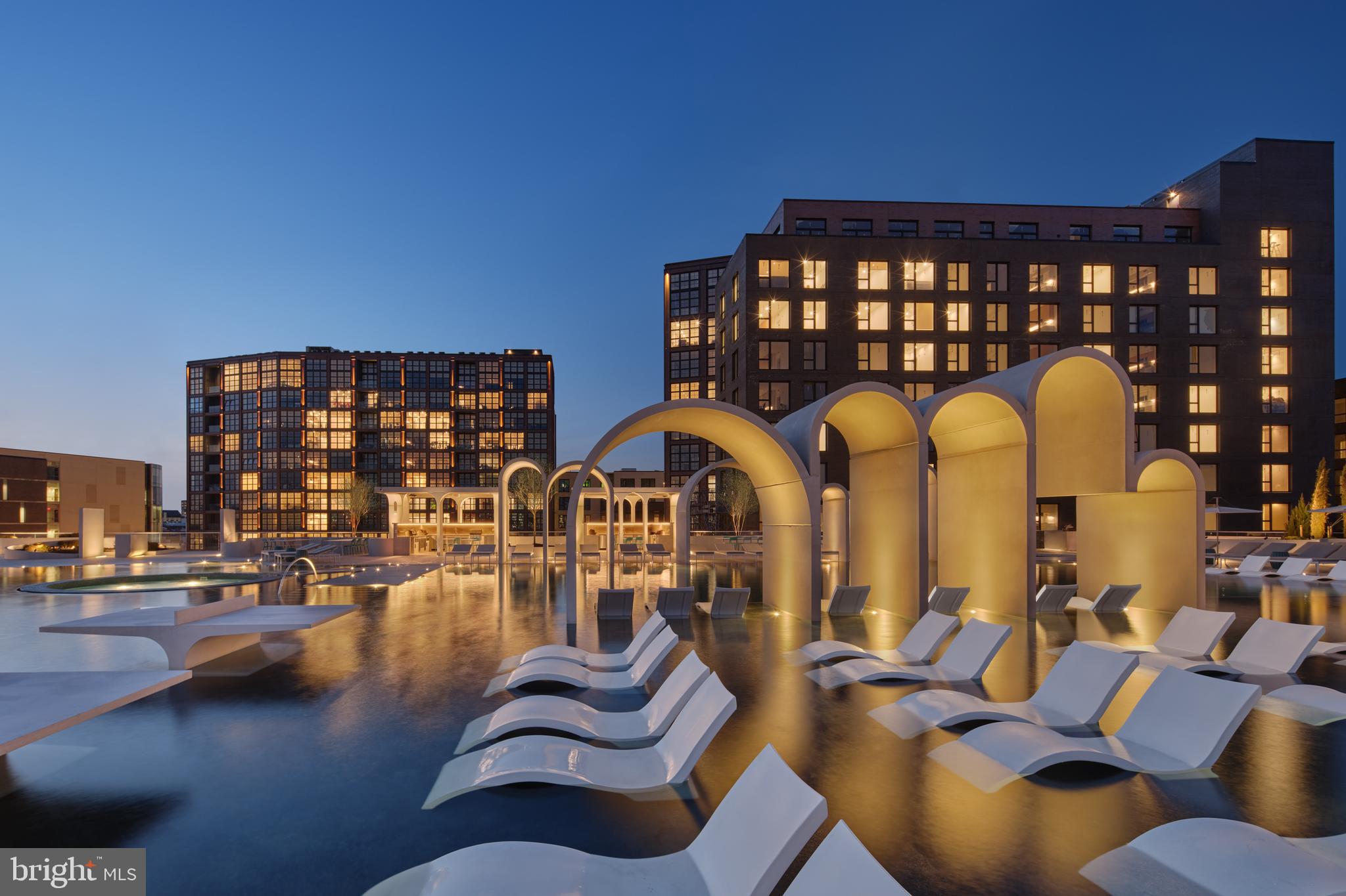 a view of swimming pool with outdoor seating