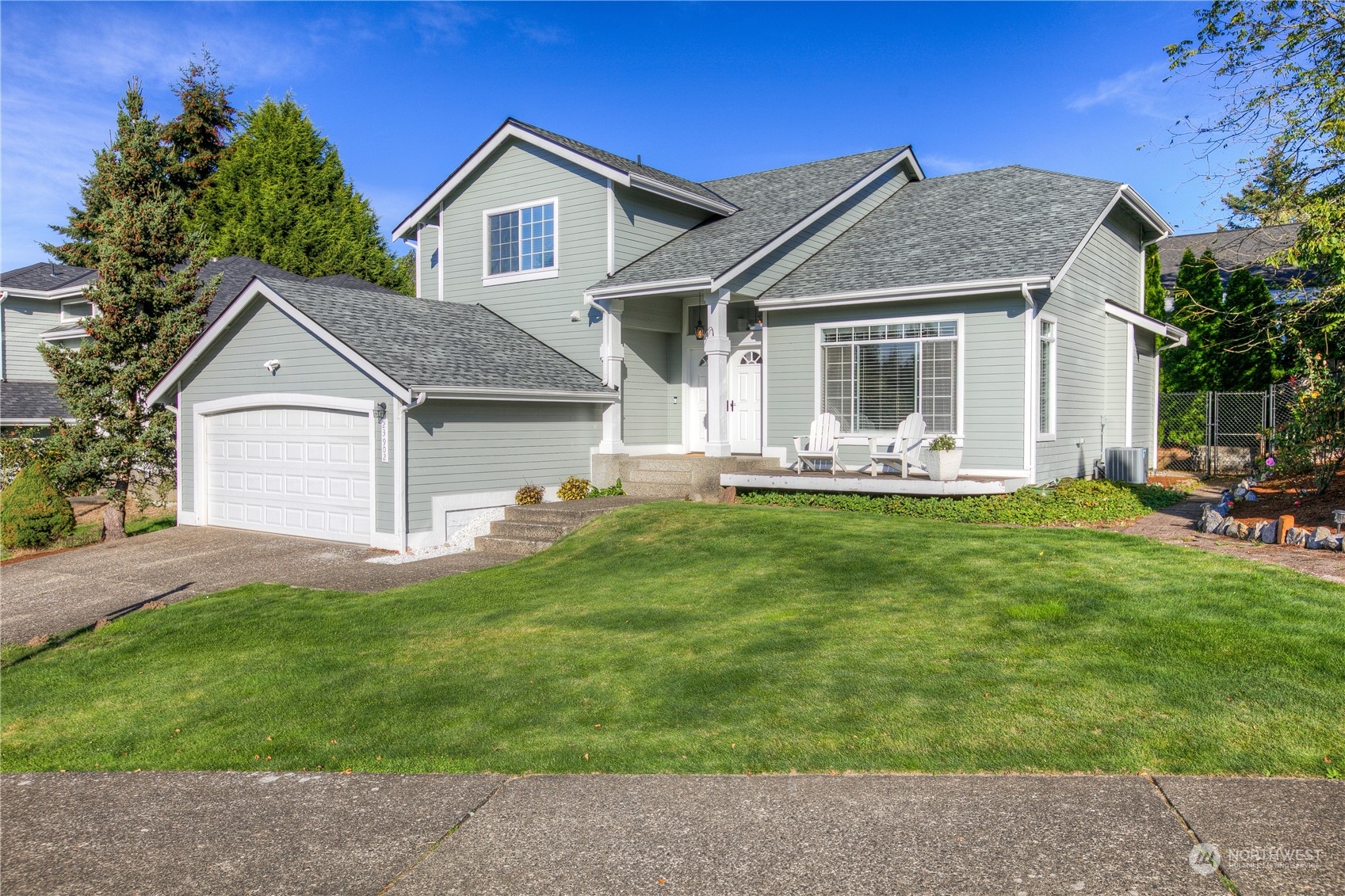 a front view of a house with a yard