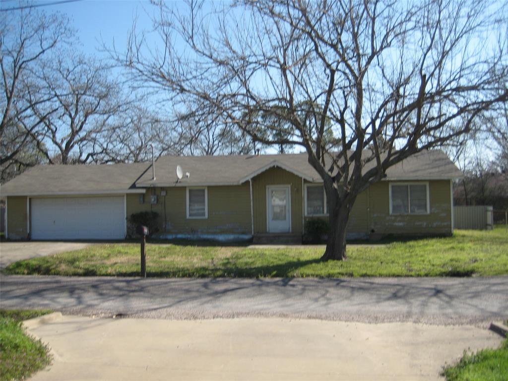 front view of a house with a small yard