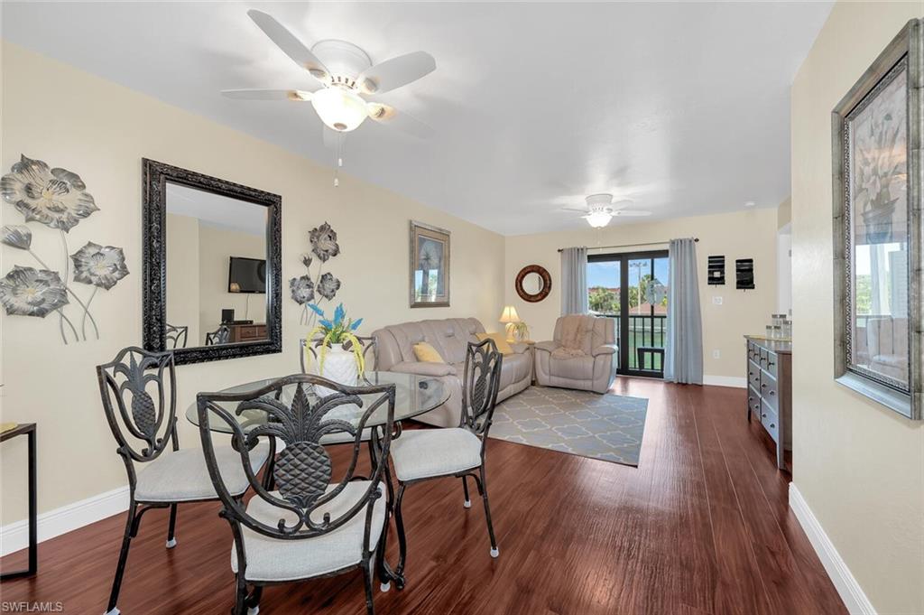 a view of a dining room with furniture and wooden floor