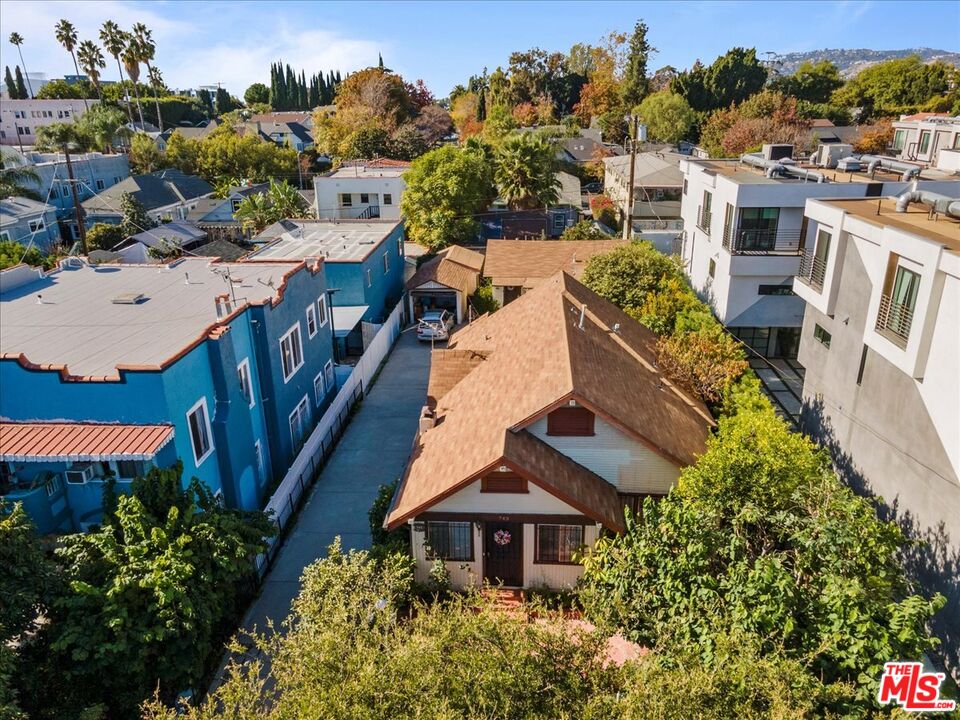 an aerial view of a house with yard swimming pool and outdoor seating