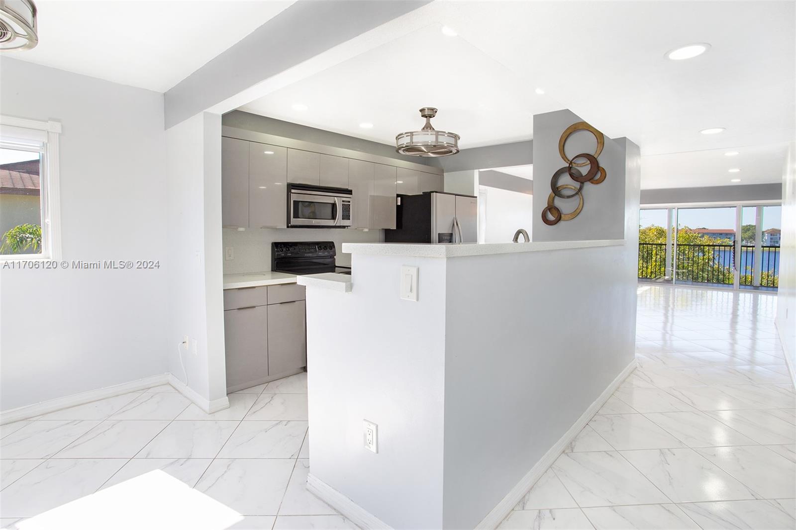 a kitchen with a sink and refrigerator