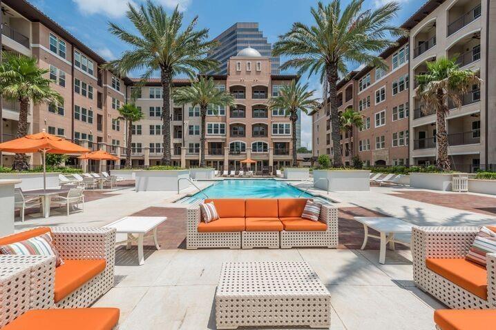 a view of a swimming pool with a lounge chairs