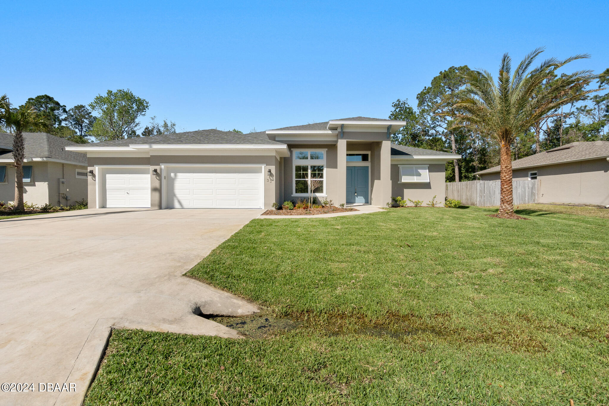 front view of a house with a yard