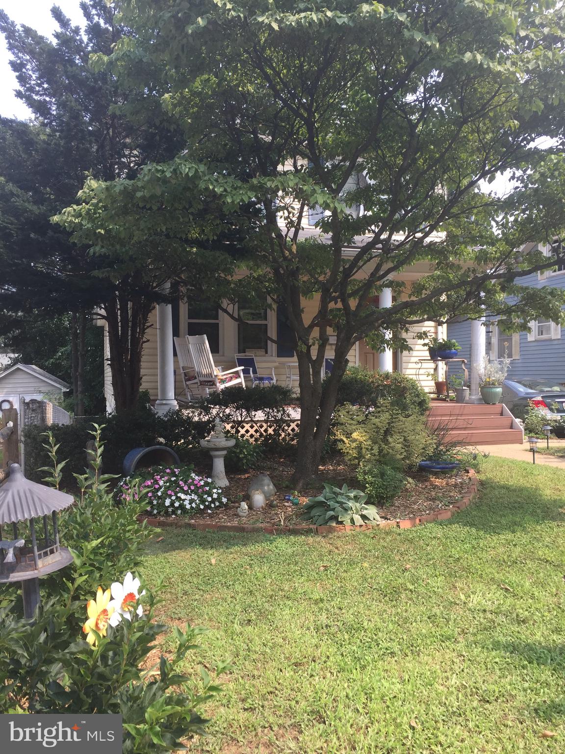 a view of a wooden house with a yard