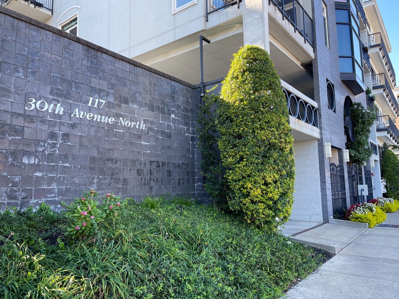 a brick building with a yard