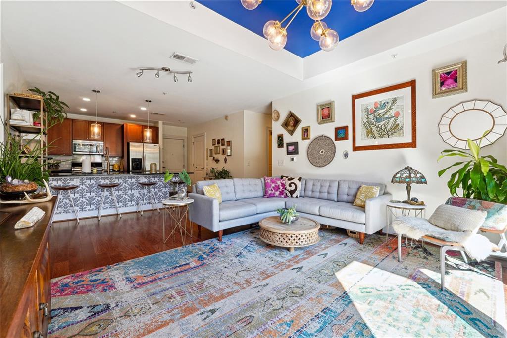 a living room with furniture and a rug