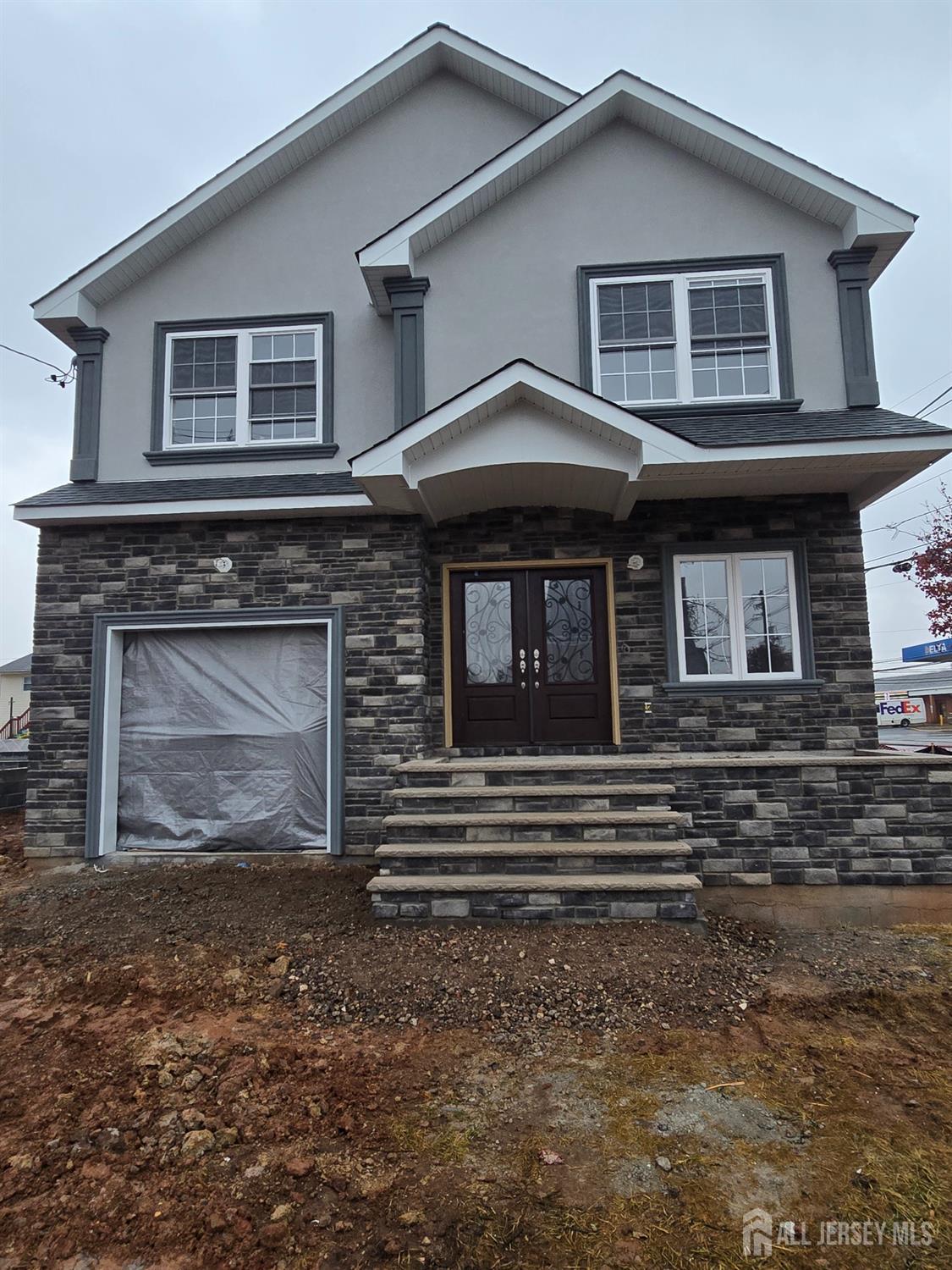 a front view of a house with a garage