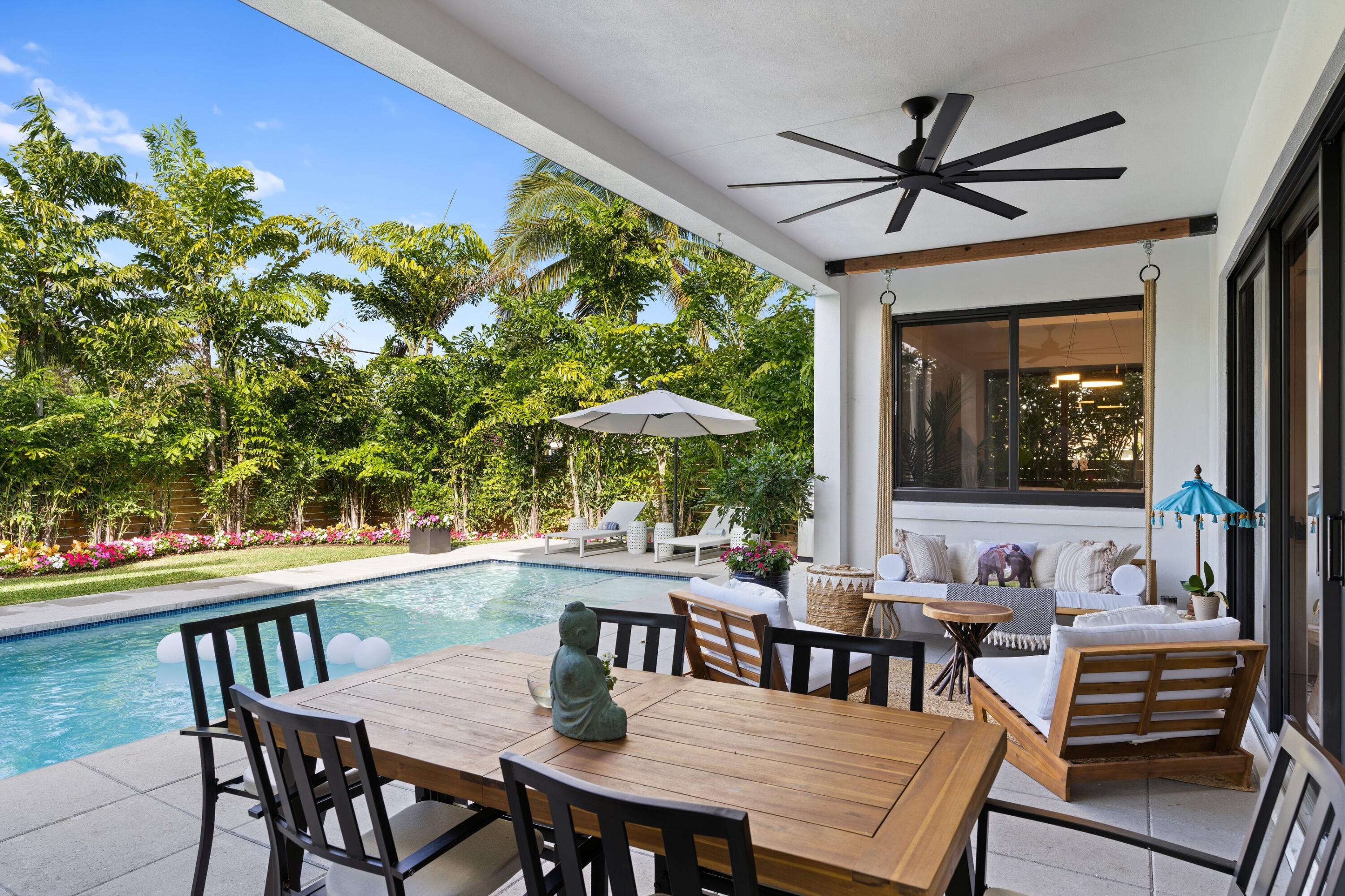 a view of a dining table and chairs in patio