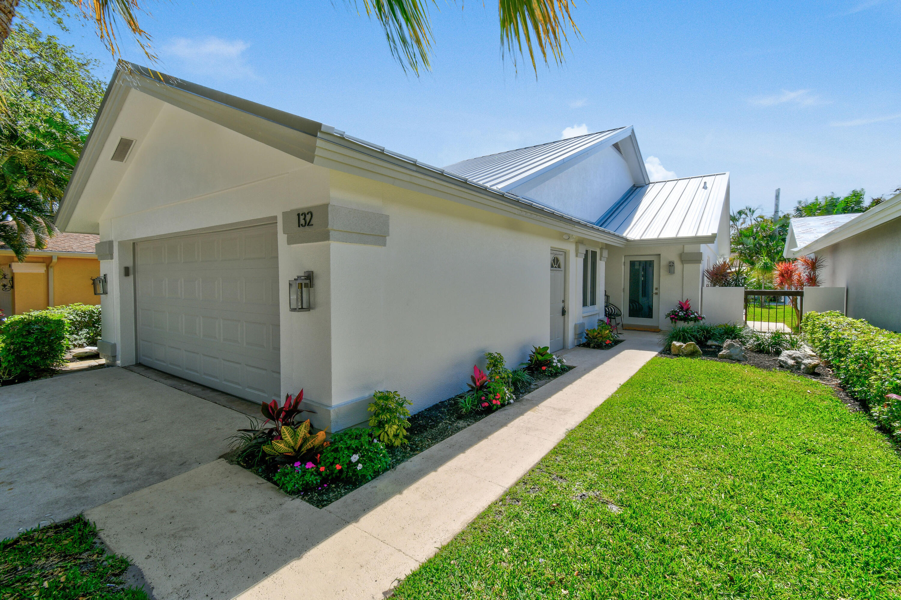 a front view of a house having a yard