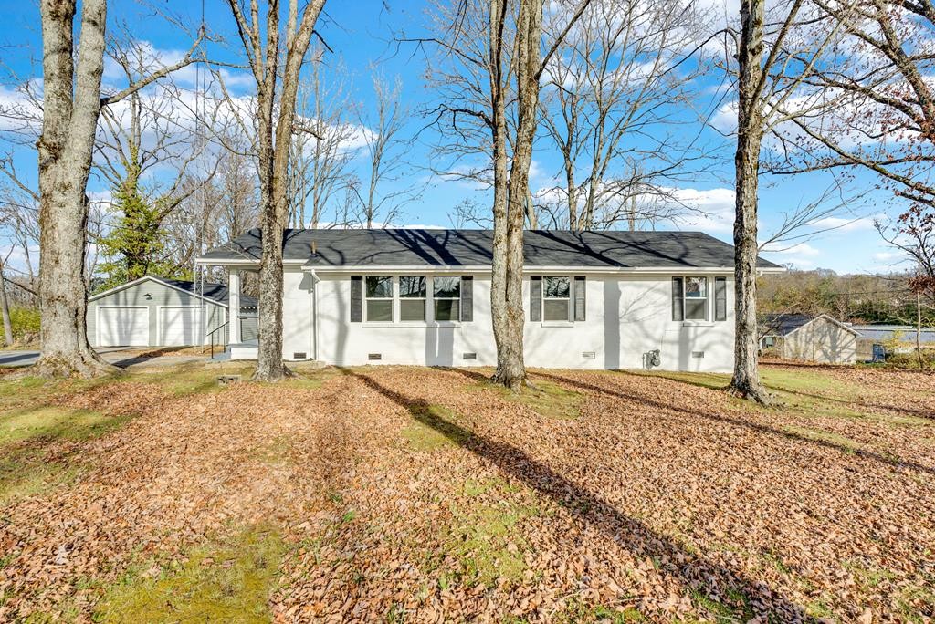 a house with trees in front of it