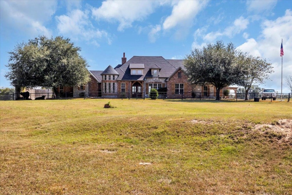 a view of a swimming pool with a house in the background