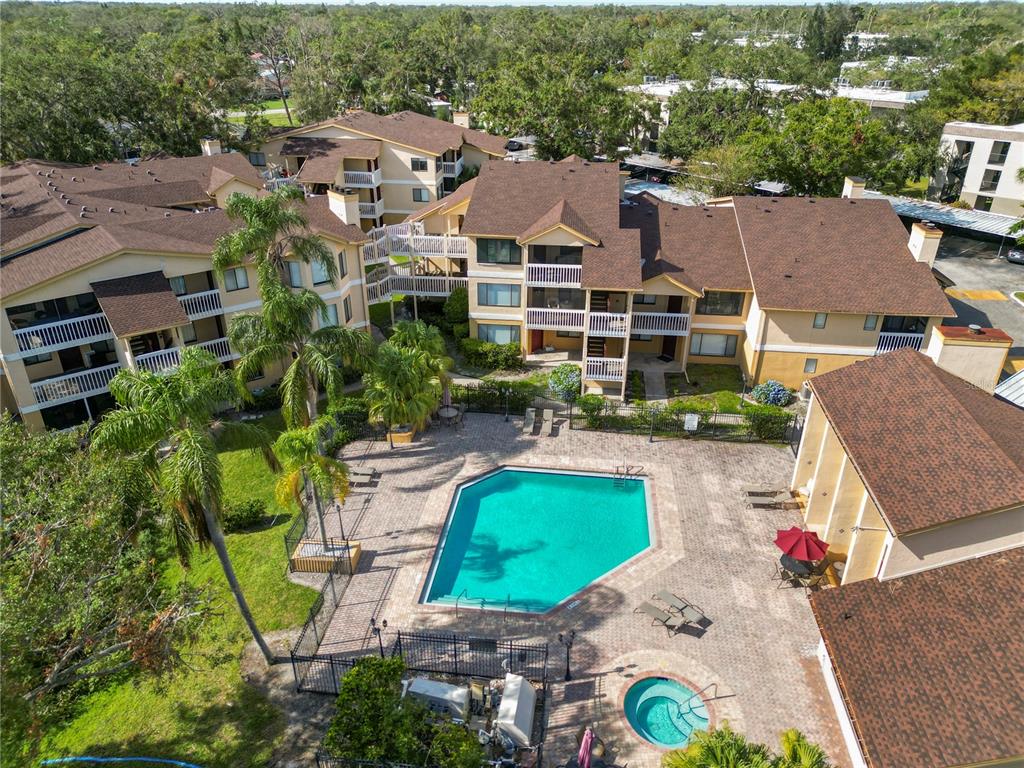 an aerial view of a house with garden space and lake view