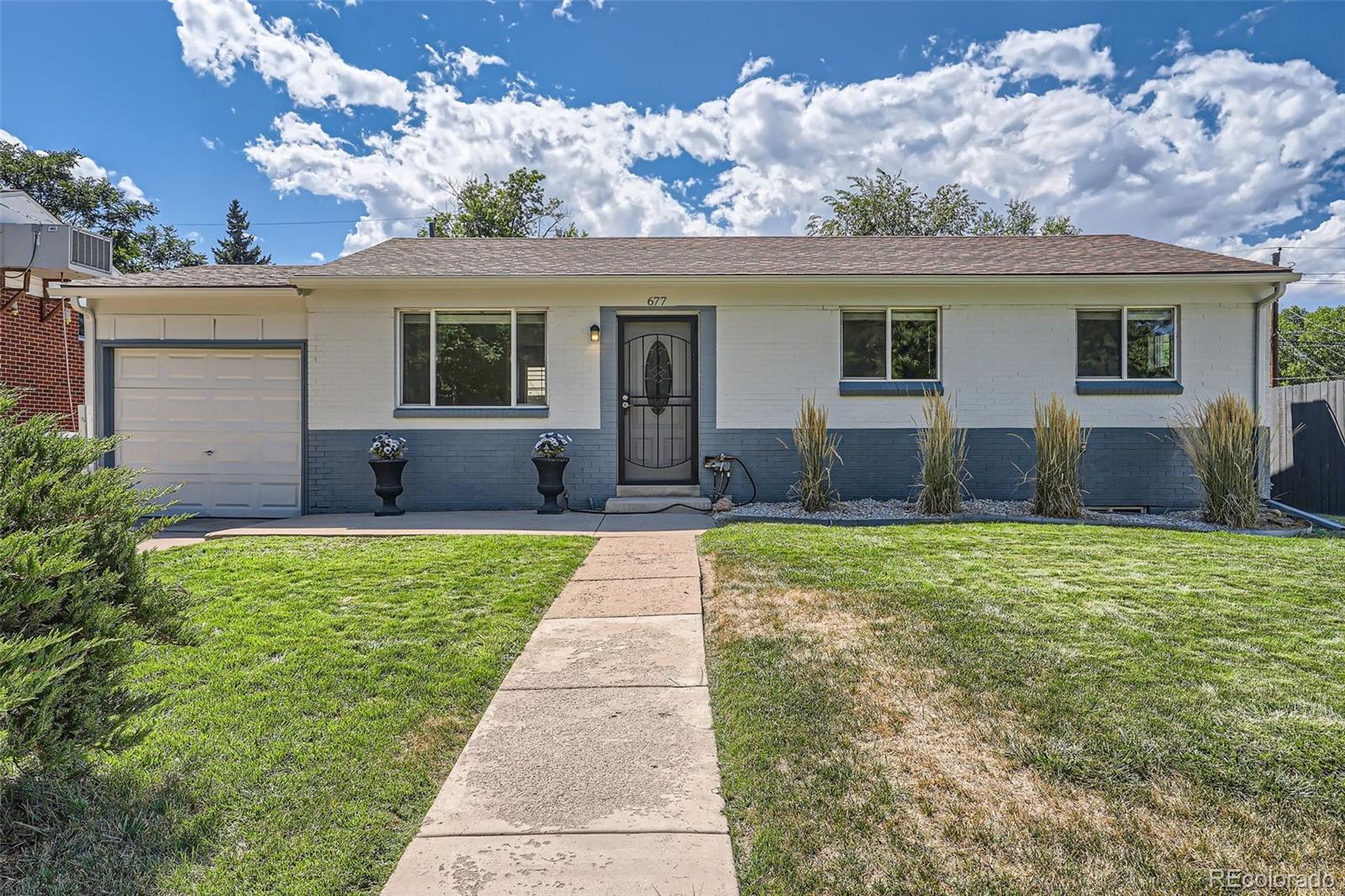 front view of a house with a yard