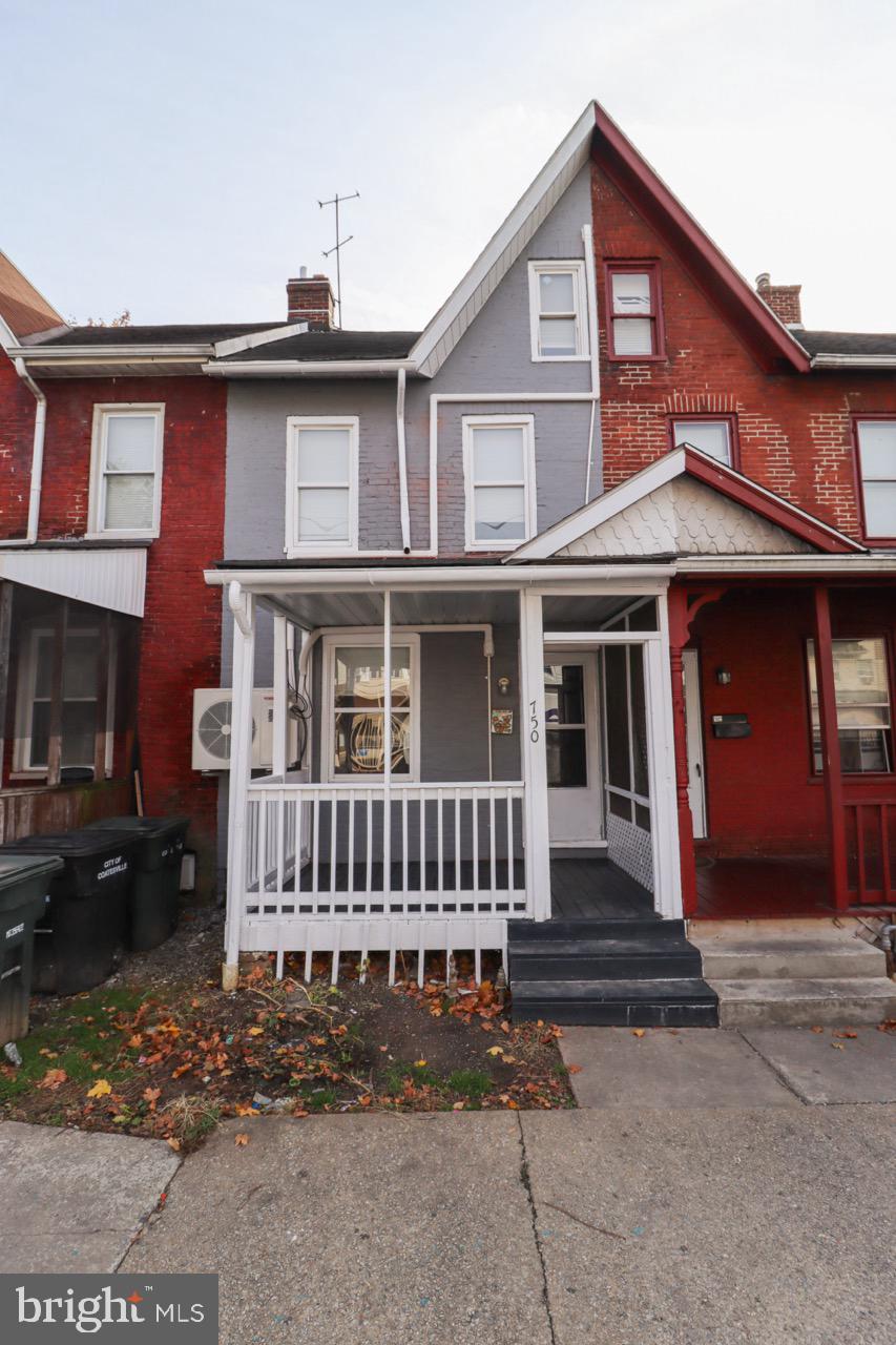 a front view of a house with a porch