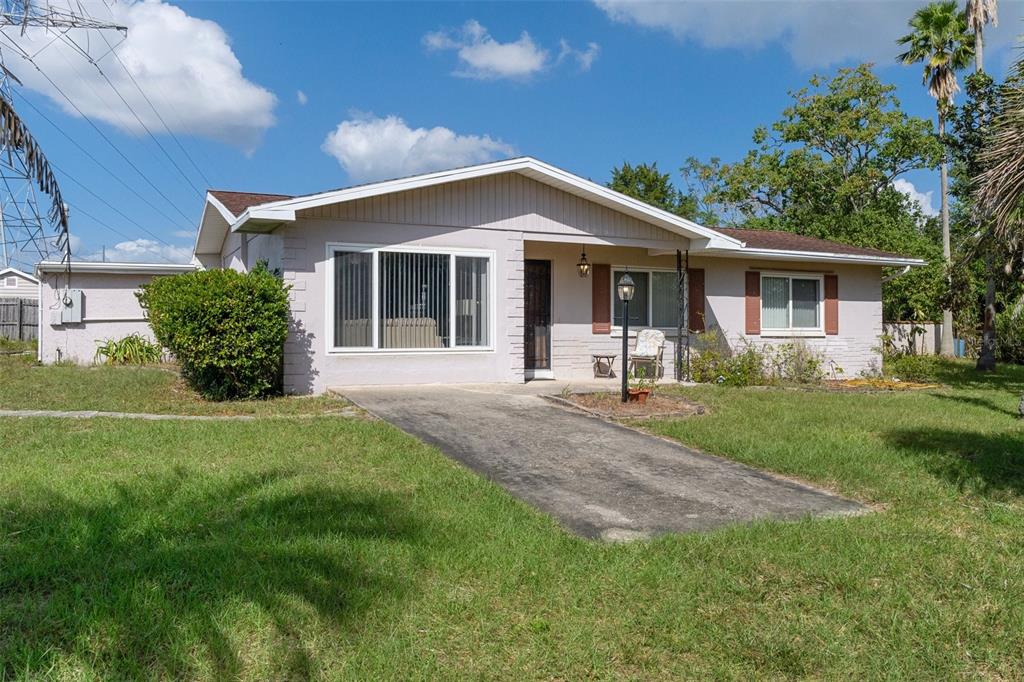 a front view of house with yard and green space