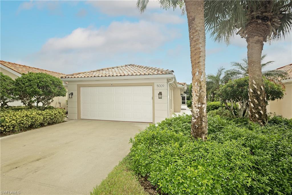 a front view of a house with a garage