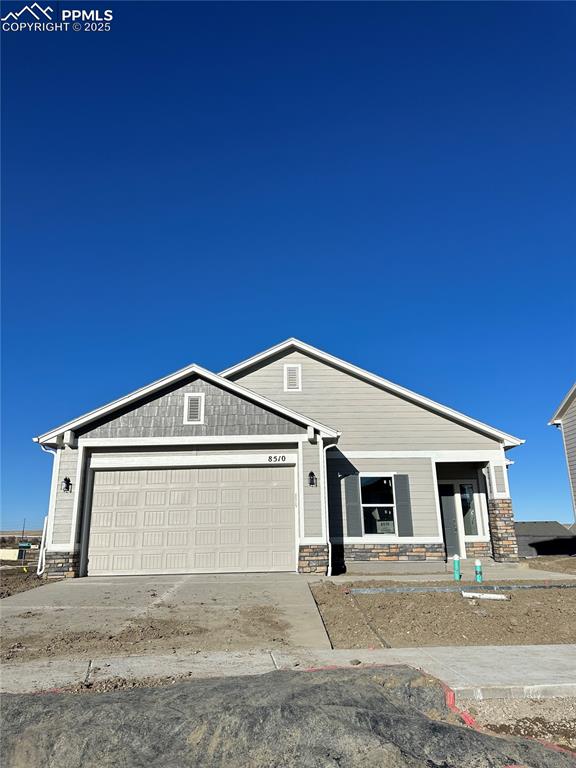 a front view of a house with a garage