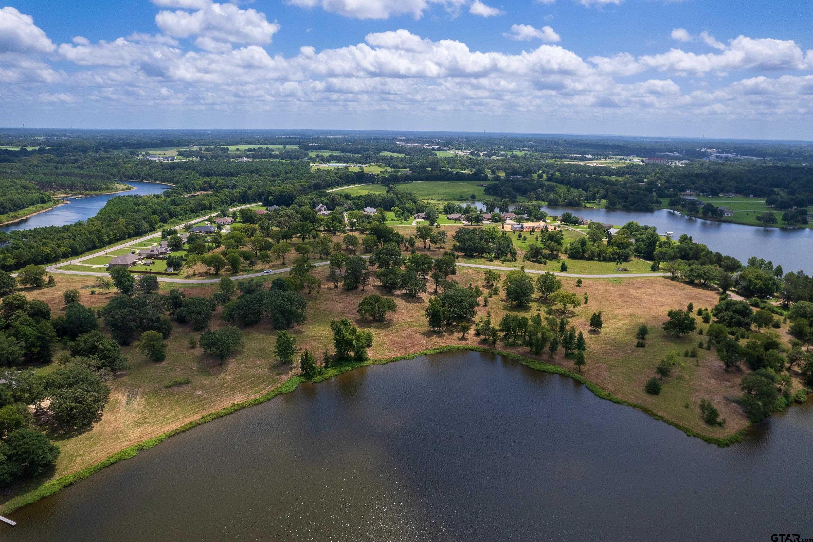 an aerial view of city and lake