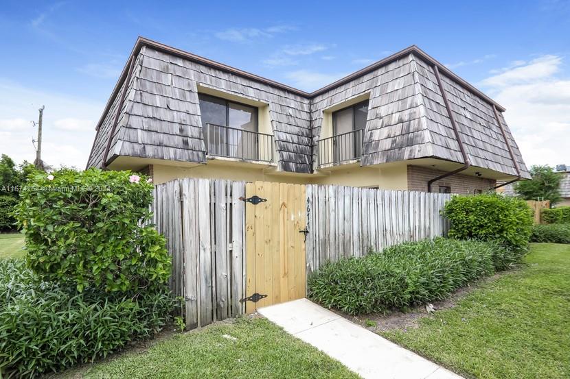 a front view of a house having yard