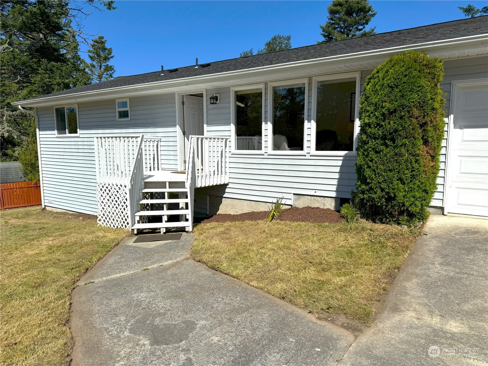 a view of a house with a yard and garage