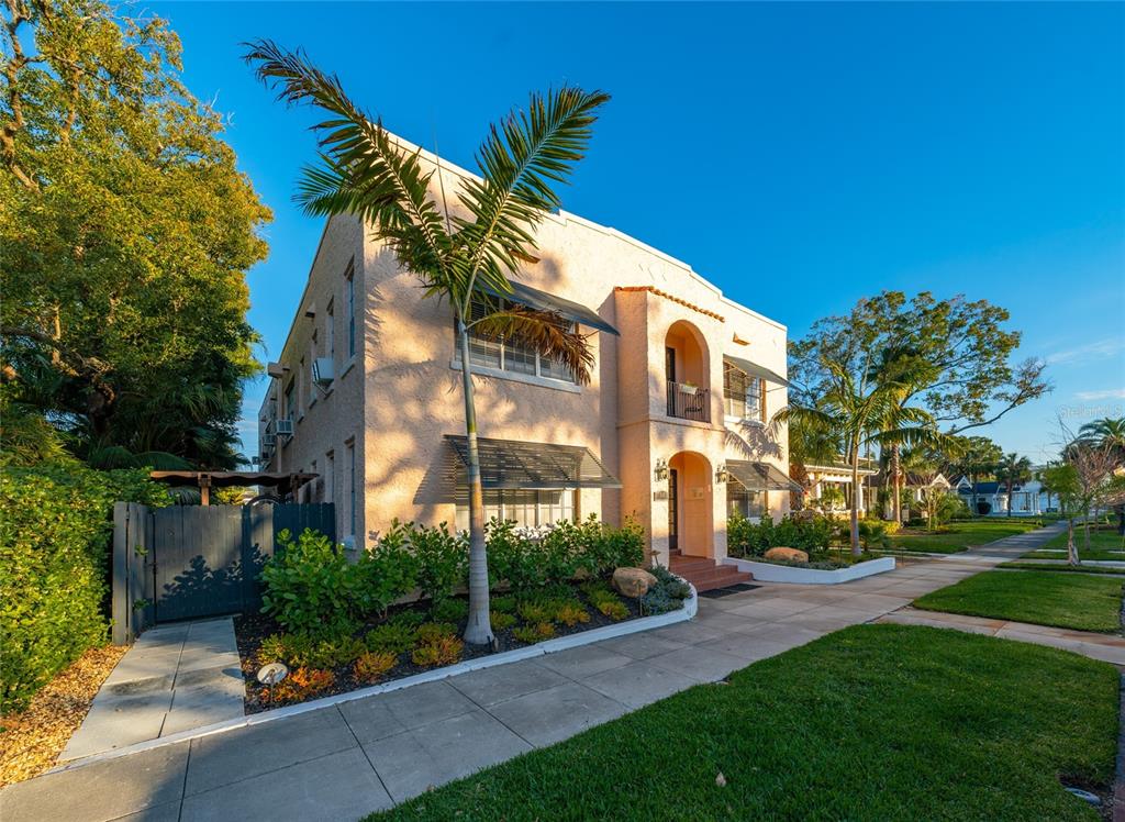 a view of a building with a yard