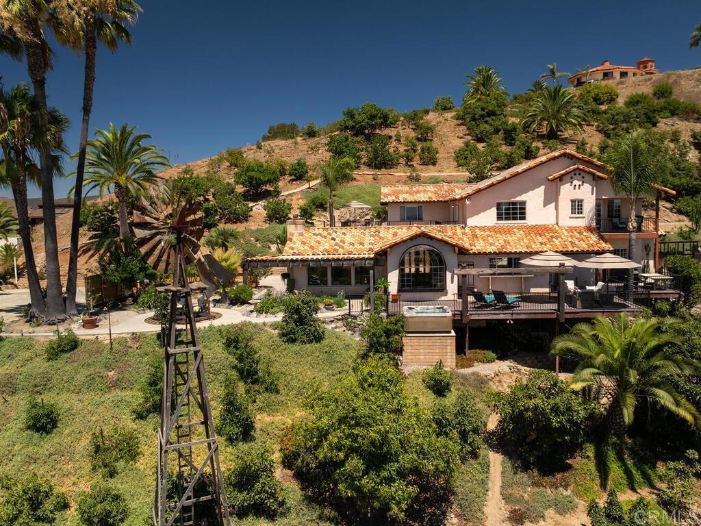 a aerial view of a house with a yard