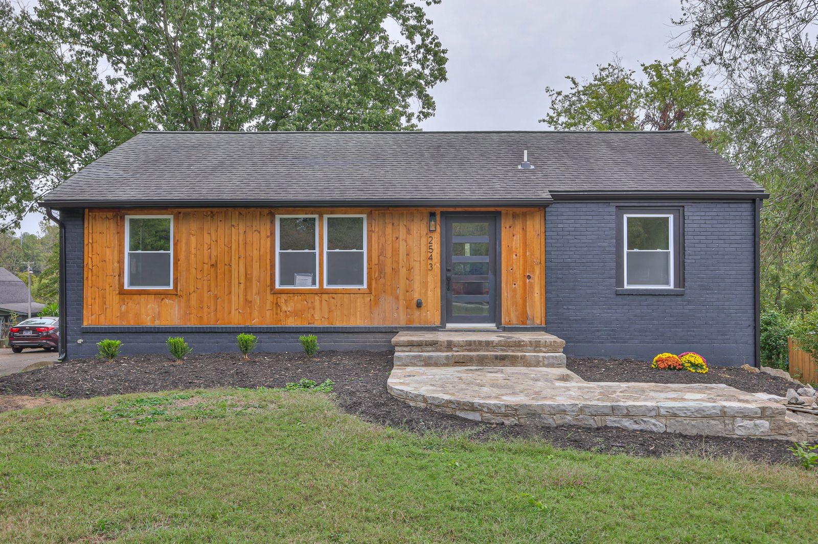 a front view of a house with garden