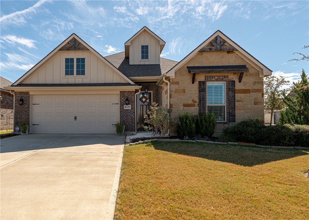 Great curb appeal with a stone and brick elevation