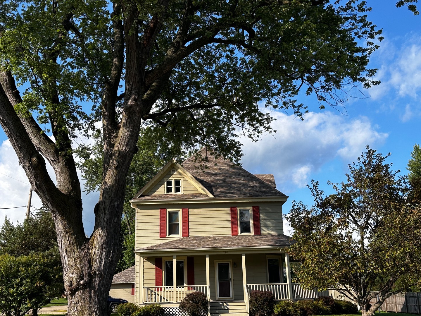 a front view of a house with a garden