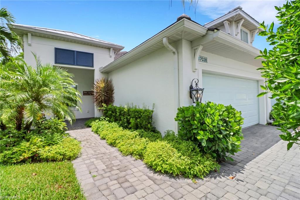 a front view of house with garden