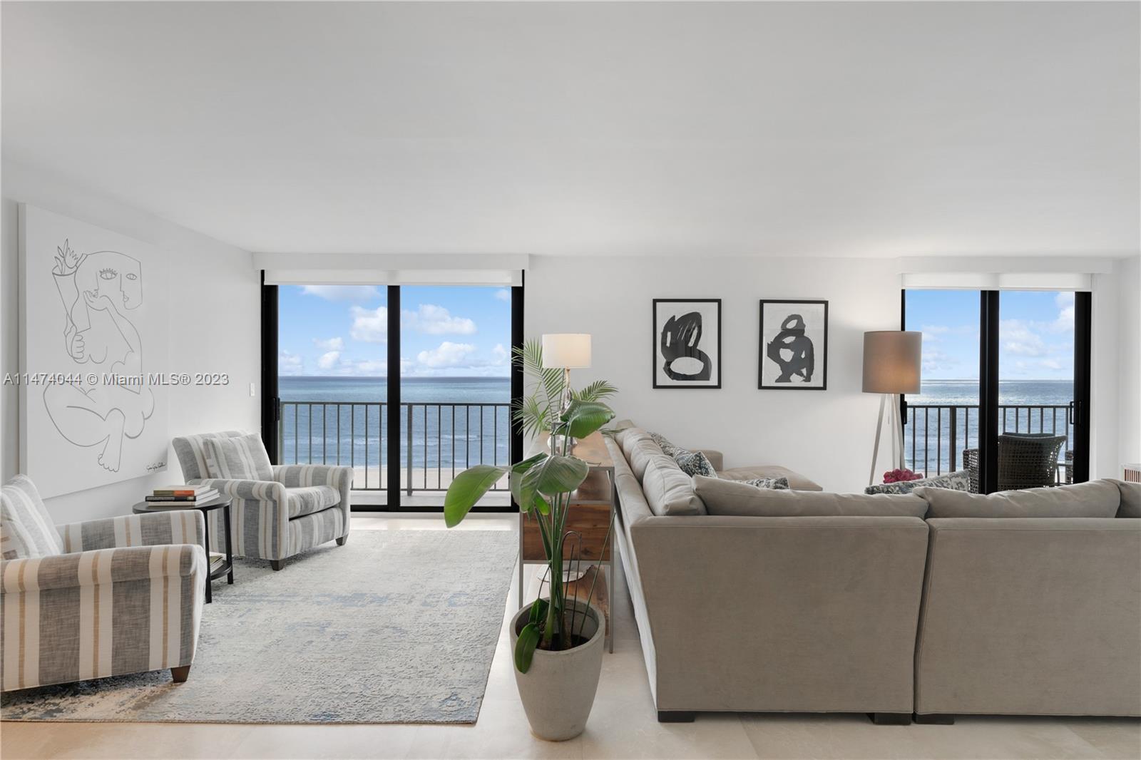 a living room with furniture window and a wooden floor