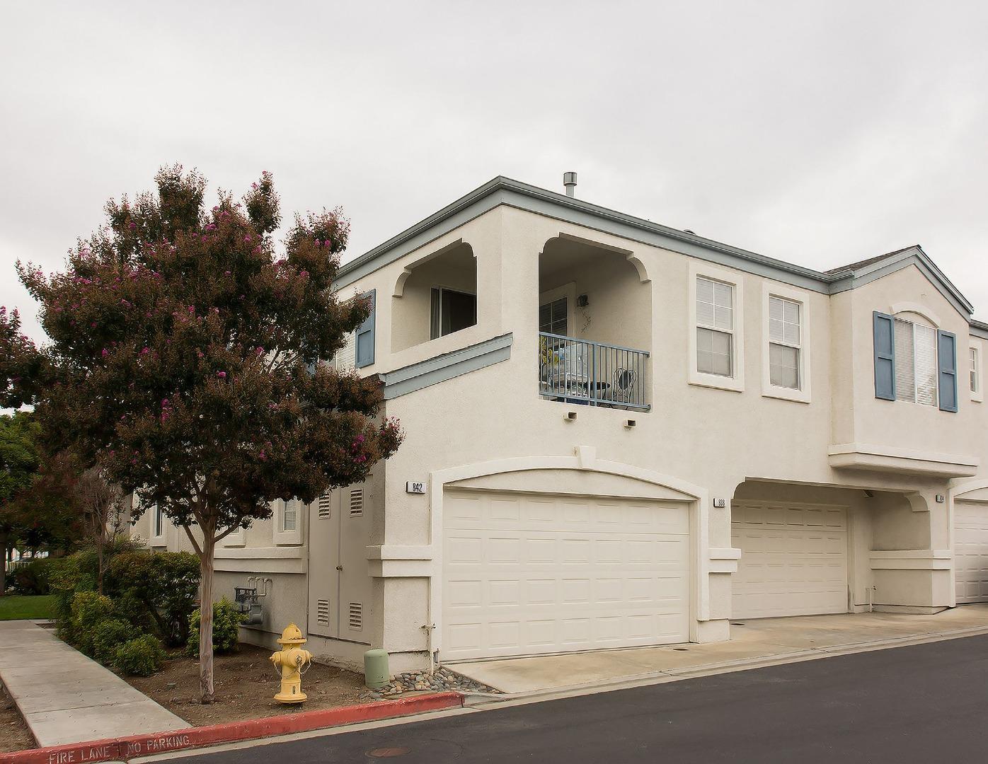 a front view of a house with garage