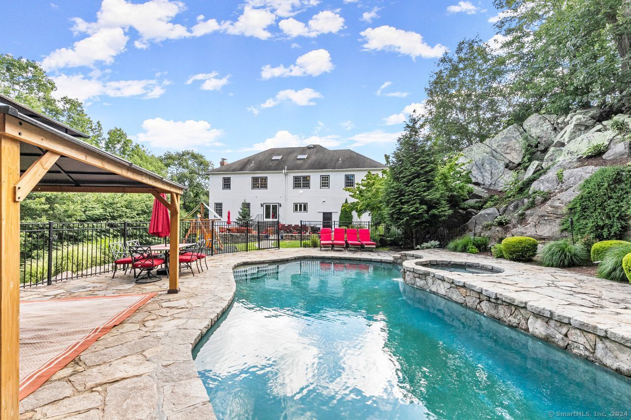 a view of swimming pool with a patio