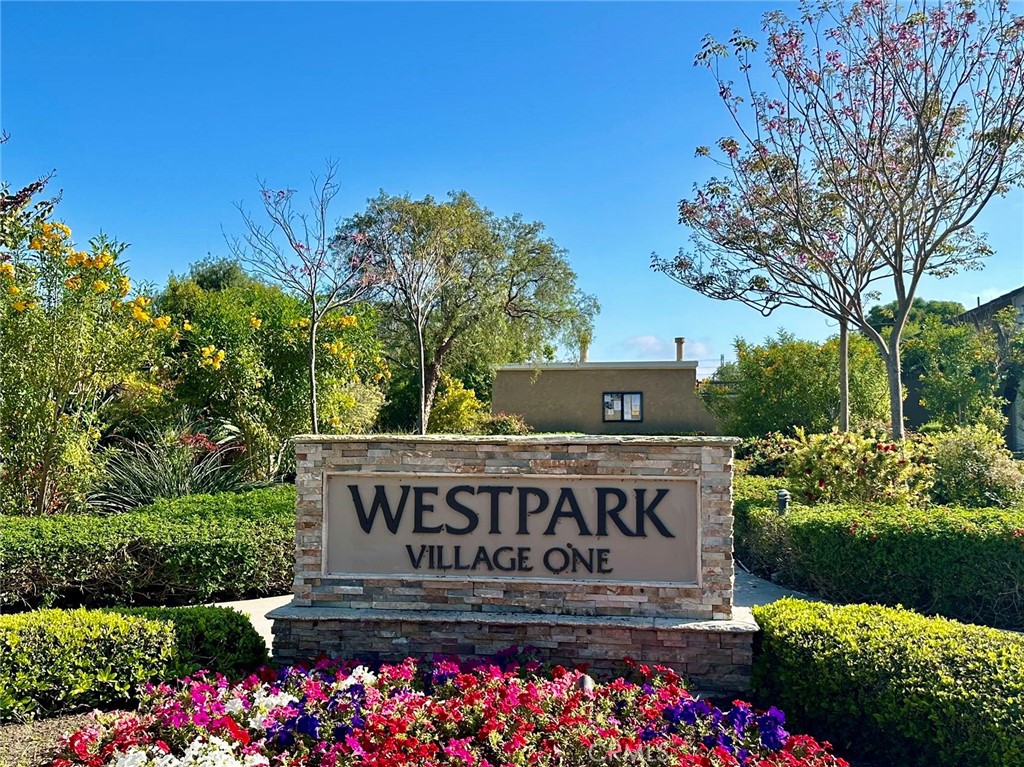 a view of sign board and tree