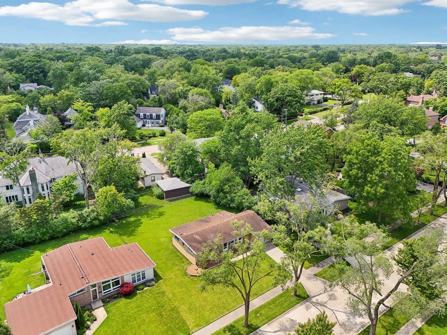 an aerial view of residential house with outdoor space and street view