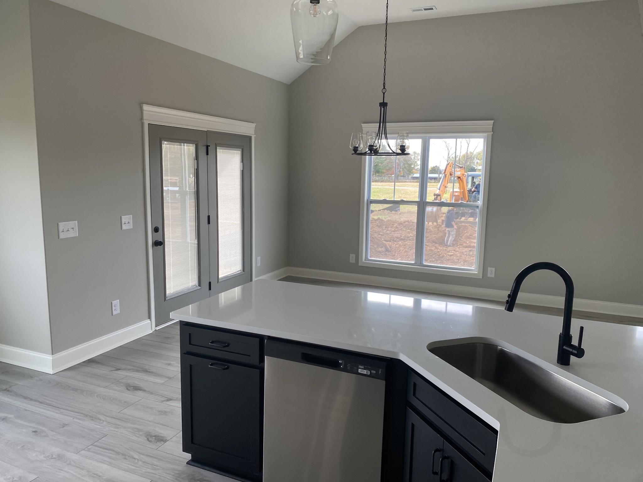 a kitchen with a sink and large window