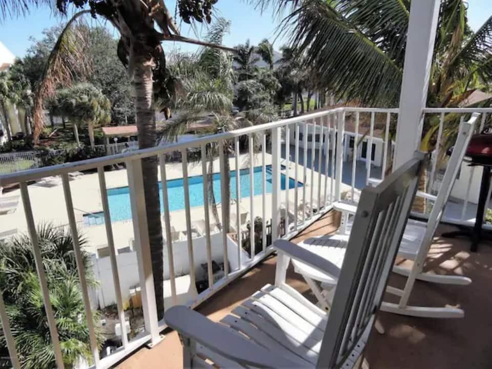 a view of balcony with wooden floor