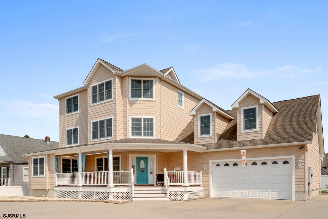 a front view of a house with a garage