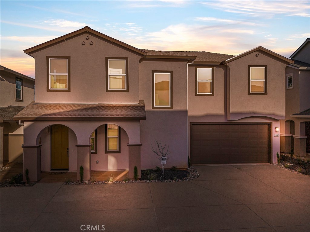 a front view of a house with yard