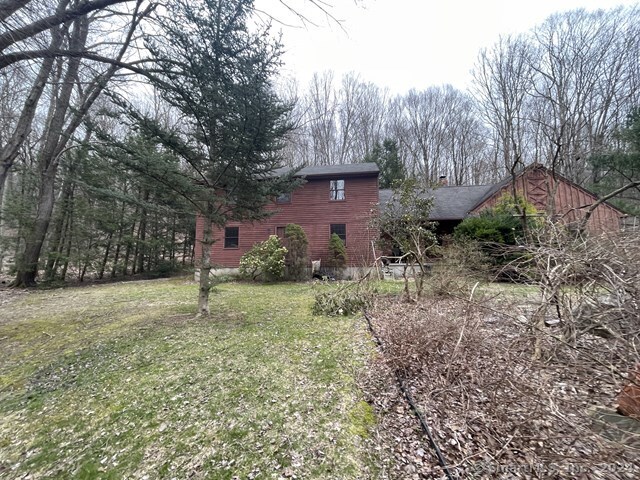 a backyard of a house with lots of green space