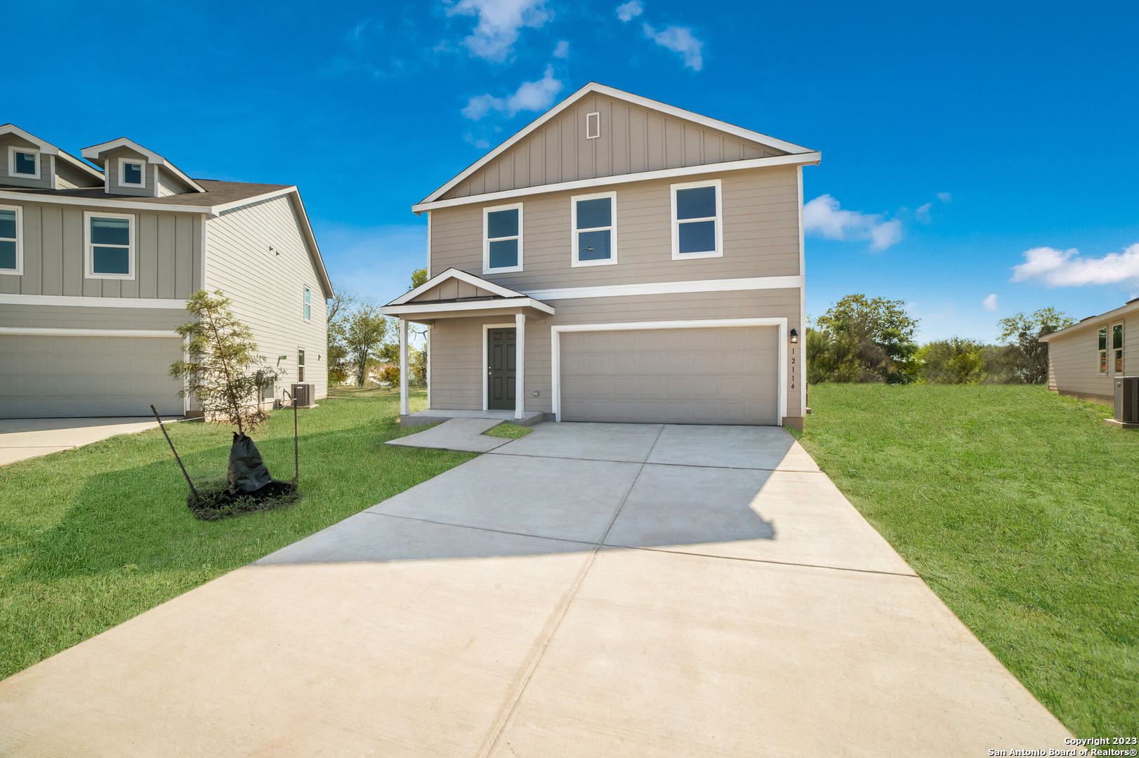 a front view of a house with a yard